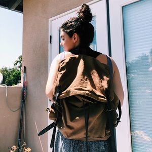 Leather belted backpack